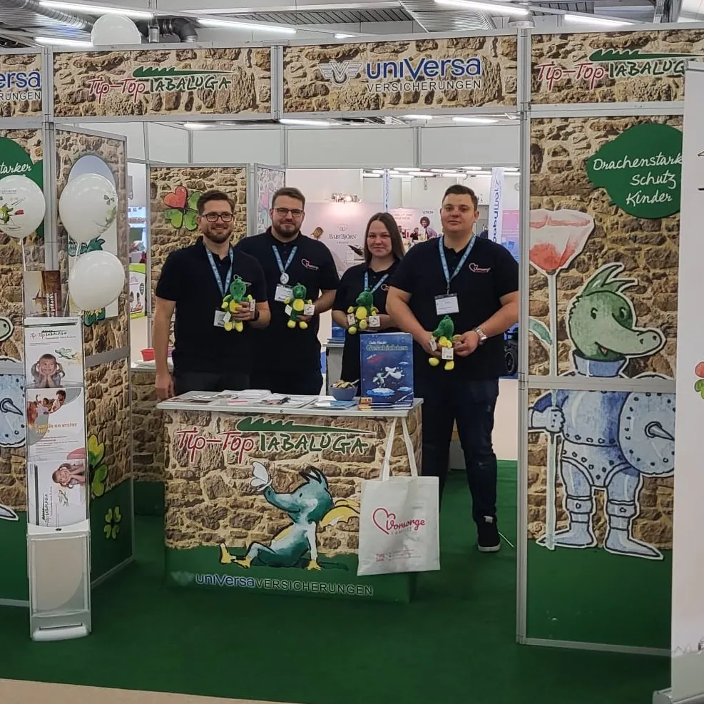 Das Team von Vorsorge Familie an seinem Messestand